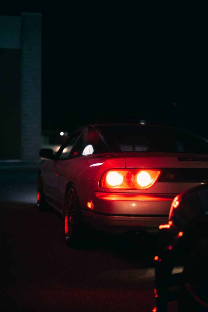 A Nissan 240SX showcasing its sleek design and iconic headlights, highlighting its legacy in the JDM scene.