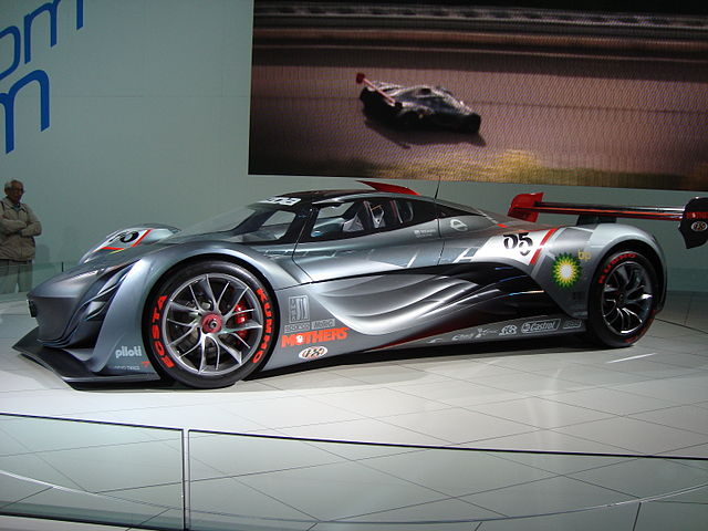 Side view of the Mazda Furai concept car highlighting its flowing lines and aerodynamic profile