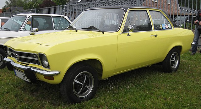 The classic Opel Ascona A (1970–1975) parked on a street, highlighting its timeless and simple design.