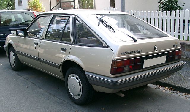 Opel Ascona C parked on the street, showcasing its classic design and sleek lines.