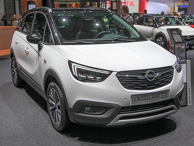 Opel Crossland parked in a showroom, showcasing its sleek design and compact crossover appeal