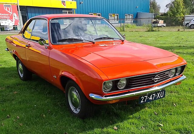 Classic Opel Manta A parked on a street, showcasing its sleek coupe design, chrome accents, and vintage charm