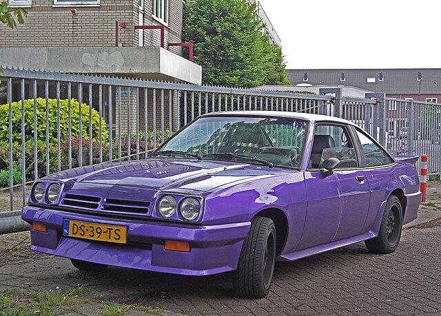 Classic Opel Manta B parked in a scenic location, showcasing its vintage design and sleek lines